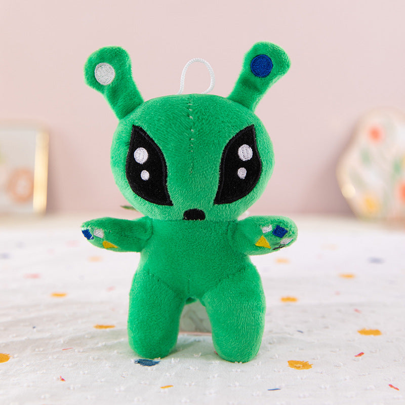 Green big eyed alien plush toy